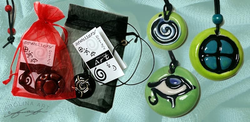 Wearable art handcrafted jewellery with positive symbols
